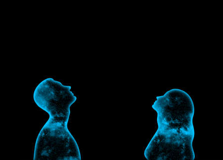 Blue shining starry universe in the form of a man and a woman looking up on a black backgroundの写真素材