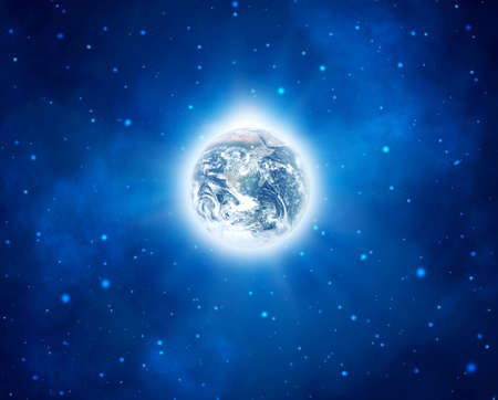 Earth with a shining white halo in the middle of blue starry space.