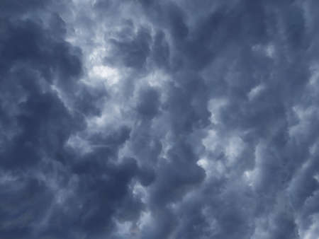 Blue and gray dramatic mammatus pre-thunderstorm clouds