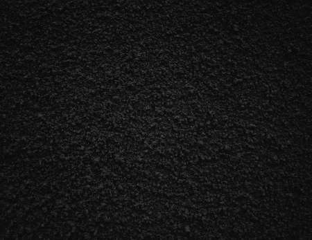 Black rough decorative plaster texture backgroundの写真素材