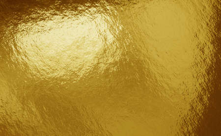 Gold foil background with highlights and uneven texture