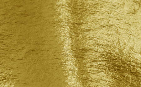 Gold foil background with highlights and uneven texture