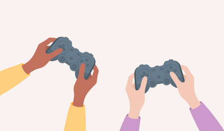 Friends playing console games. Two pairs of hands with different skin tones holding game...