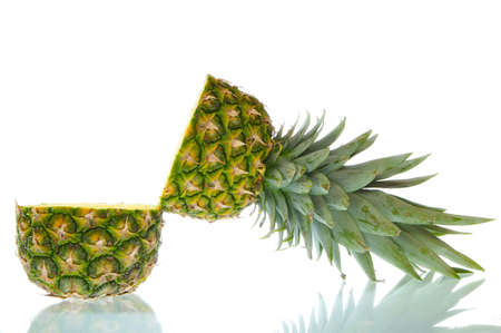 Open pineapple with reflections isolated on a white background.の写真素材