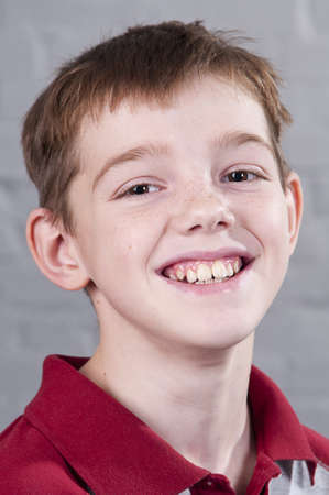 Portrait of smiling boy 10 years. Studio shoot.