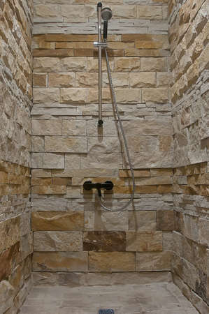 Shower room with stone tiles for one personの写真素材