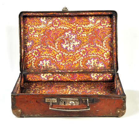 Open old brown suitcase, isolated on white backgroundの写真素材