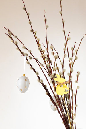 Spring crochet and knitting. Beautiful Easter still life with a bouquet of willow twigs decorated...
