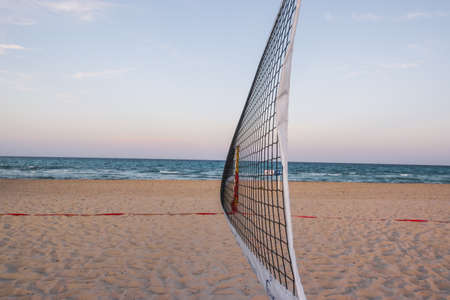 Beach volleyball with a view of the seaの写真素材