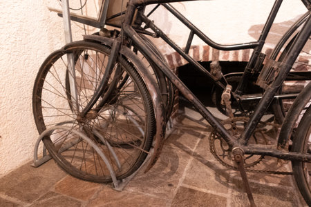 Old bicycles in front of a wallの写真素材