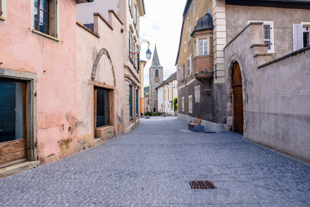 Narrow Alley Amidst Buildings - Sierre, Switzerlandの写真素材