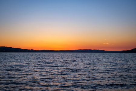 Sun Setting Over The Horizon - Sempach, Switzerlandの写真素材