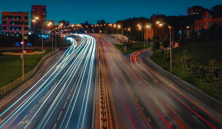 Lights of cars with night. Direction of traffic on the highway.の写真素材