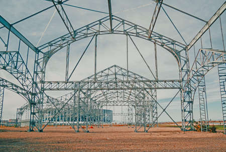 Steel beams on blue sky background. The construction of steel structureの写真素材
