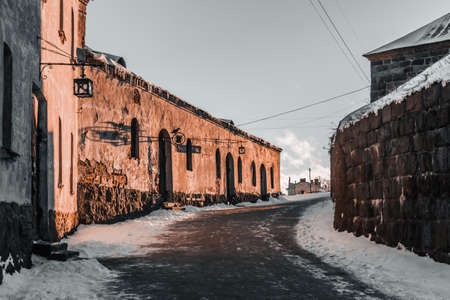 Wonder winter view of the medieval cobbled street in the Vyborg .