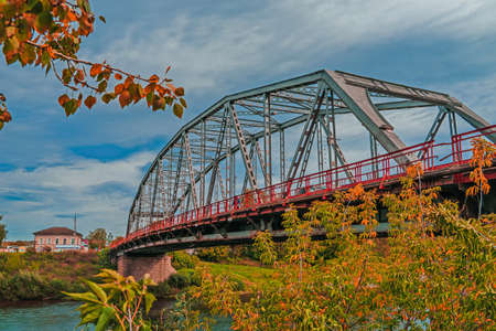 Metal construction of the city bridge on a sunny day in Kungur, Perm krai, Russia.の写真素材