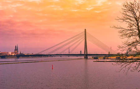 Vansu Bridge across Daugava or Dvina river. Riga, Latvia sunset cityscape .の写真素材