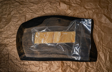 Cold Smoked oily fish Fillet vacuum-packed. Seafood on a craft paper background. Top view.の写真素材