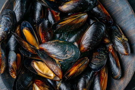 Close up of delicious steamed mussels in a wooden bowl.の写真素材
