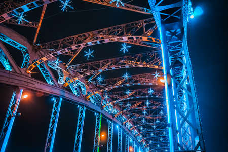 Bolsheokhtinsky Bridge through the Neva River. St. Petersburg in the winter evening. Evening city...