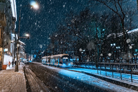 Modern moscow tram running through the snow. Electric city transport in Moscow, Russiaの写真素材