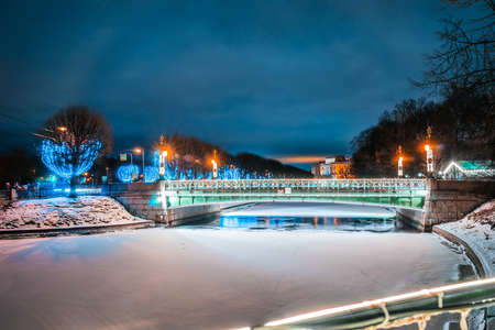 View of the Second Sadovy Bridge in winter St. Petersburg. Holiday illumination in the city.の写真素材