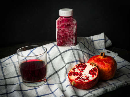 Pomegranate juice bottle ice cold. Ice fresh pomegranate juice frozen.の写真素材