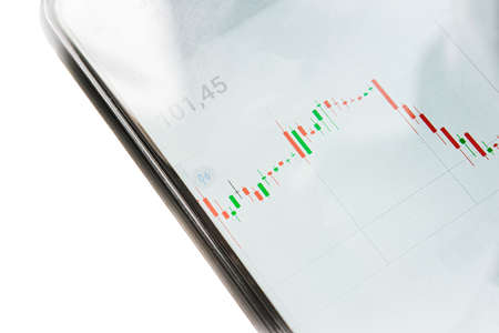 Downward stock quotes on the phone screenの写真素材