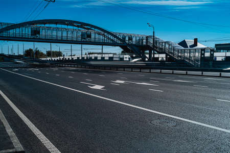 Empty motorway. Elevated pedestrian crossing across the road.の写真素材