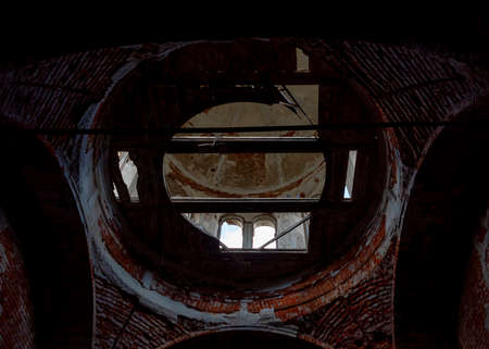 Inside view of the dome. An abandoned church in Tatarstan, Russia. Ruins of an old abandoned brick church.の写真素材