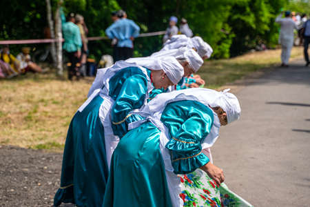Kazan, Russia, June 26 2021. The Tatar ethnic holiday Sabantui, end of field works. Traditional Tatar costume with ornamentation.のeditorial素材
