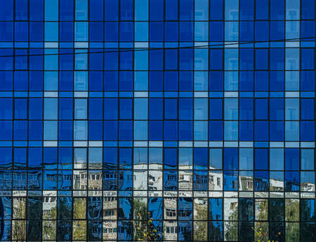 Pattern from blue windows in modern residential building. The texture of the building facadeの写真素材