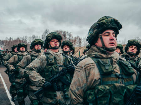 Kazan, Russia. 08 November 2021. Special forces soldiers with rifle in full gear. Camouflaged soldier marching in formation.のeditorial素材