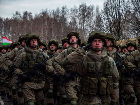 Kazan, Russia. 08 November 2021. Special forces soldiers with rifle in full gear. Camouflaged soldier marching in formation.のeditorial素材