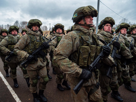 Kazan, Russia. 08 November 2021. Special forces soldiers with rifle in full gear. Camouflaged soldier marching in formation.のeditorial素材