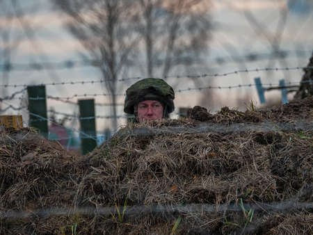 Kazan, Russia. 08 November 2021. A soldier on duty in a trench at a peacekeeping post. The line of demarcation. Russian Armed Forcesのeditorial素材