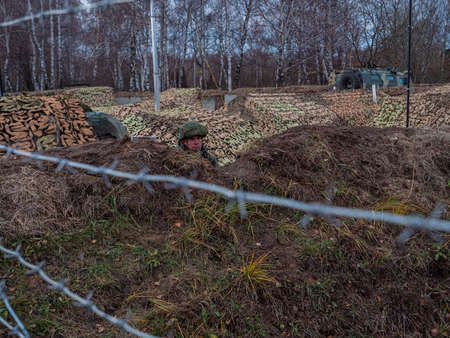Kazan, Russia. 08 November 2021. A soldier on duty in a trench at a peacekeeping post. The line of demarcation. Russian Armed Forces. Army exercises of Collective Security Treaty Organization countriesのeditorial素材