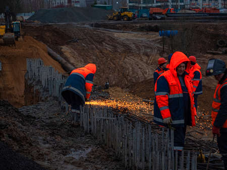 Kazan, Russia. 10 November 2021. Welding rebar for road tunnel construction. A welder is welding metal parts.のeditorial素材
