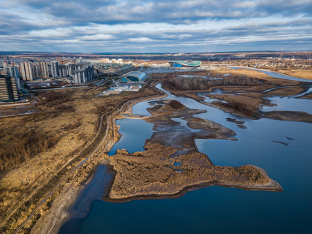 Urban neighborhoods next to the river. Nature in the city. A beautiful spill of the river. Kazan, Russia.の写真素材