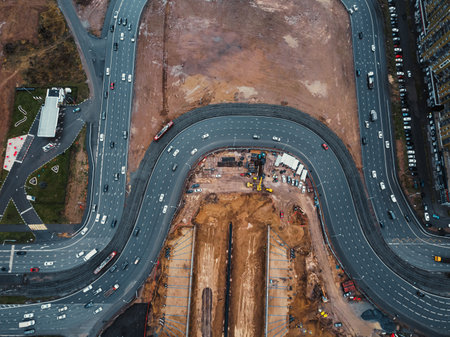 Construction of a tunnel under the motorway. Construction of a traffic interchange. Drone view. Diversions of the construction site.の写真素材