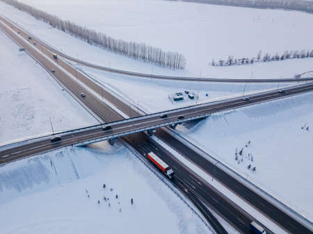 Transport junction traffic road. Aerial high above view of modern road junction. Top down aerial winter viewの写真素材