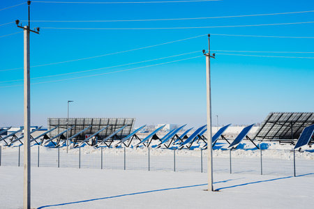 Solar panes in a solar park used for clean energy production. Photovoltaic power plant in winter.の写真素材