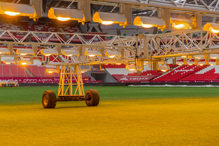 Kazan, Russia. 2022 March 28. Assimilation lighting in soccer stadium. Lighting assimilation off grass. Close up view of light therapy in stadium. The LED grass grow lightsの写真素材