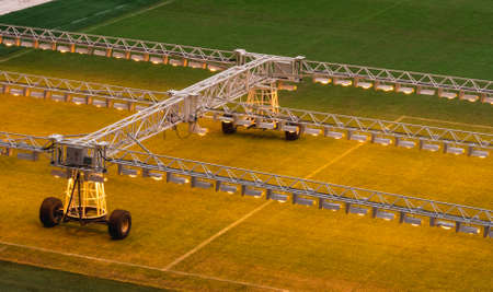Assimilation lighting in soccer stadium. Lighting assimilation off grass. Aerial view of light therapie in stadium.の写真素材