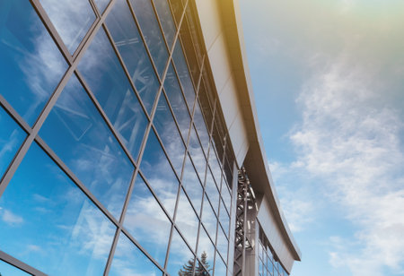 Part of the glass facade of an office building in the light of sunset. Urban abstractの写真素材