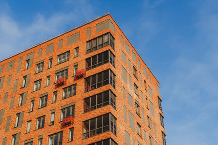 Izhevsk, Russia. May 01, 2022. Windows of the residential building. Urban obsolete facade of house.のeditorial素材