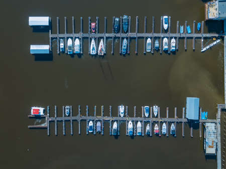 Boat and yacht parking. A marina lot. Yacht and sailboat is moored at the quay.の写真素材