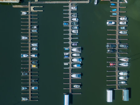 Boat and yacht parking. A marina lot. Yacht and sailboat is moored at the quay.の写真素材