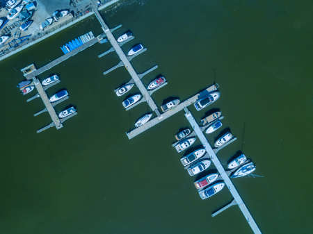 Boat and yacht parking. A marina lot. Yacht and sailboat is moored at the quay.の写真素材