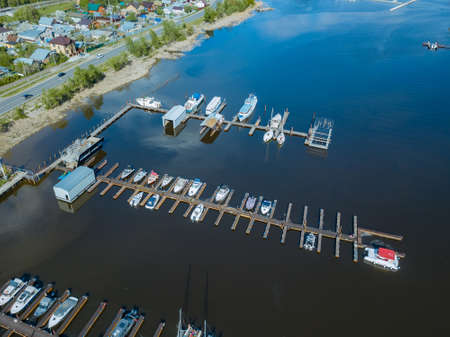 Boat and yacht parking. A marina lot. Yacht and sailboat is moored at the quay.の写真素材